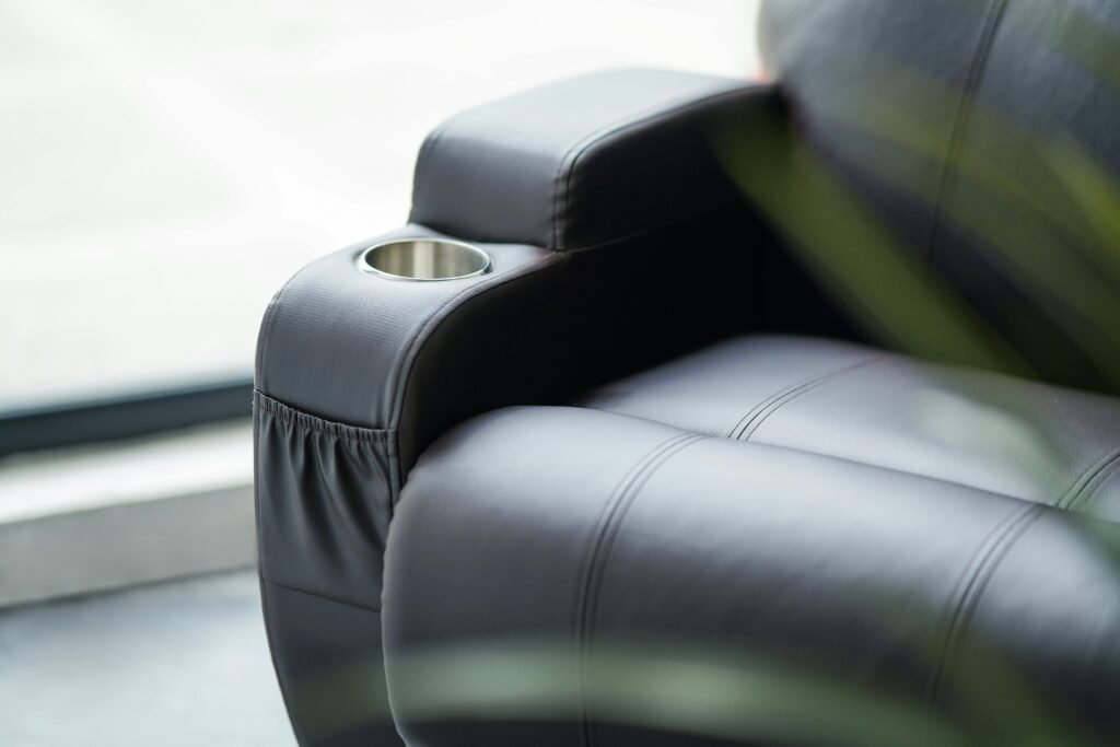 Elegant leather armchair with built-in cup holder 